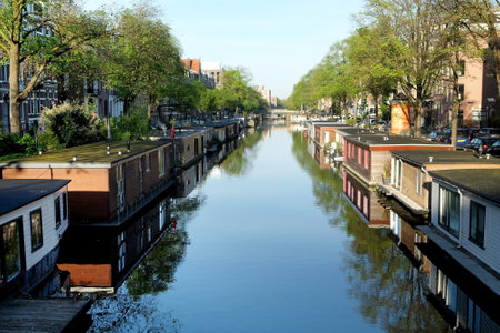 AMSTERDAM, NETHERLANDS - MAY 14, 2017: Houseboat on the canal in the historic part of Amsterdamのeditorial素材