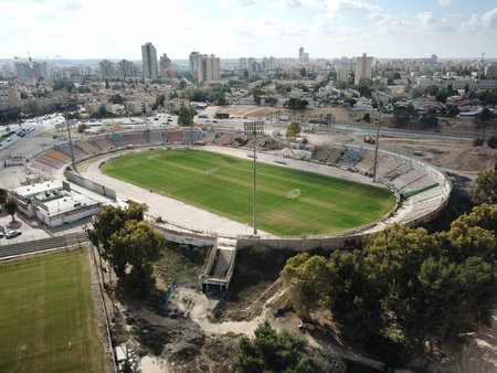 BEER SHEVA, ISRAEL - DECEMBER 15, 2017: Top view of an old football stadium among residential areasのeditorial素材