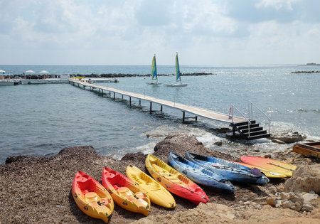 PAPHOS, CYPRUS - MAY 9, 2019: View of the sea, marina and pleasure boats at the Mediterranean coast of Paphosのeditorial素材