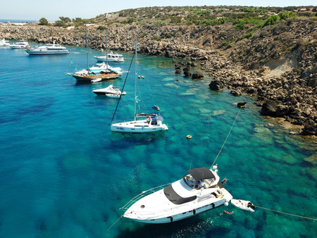 CAPE GRECO, CYPRUS -  AUGUST 09, 2019: Top view of yachts moored in the Blue Lagoon near the coastlineのeditorial素材