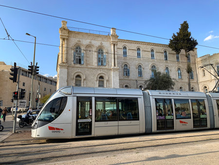 JERUSALEM, ISRAEL - OCTOBER 24, 2019: High-speed tram in the background of the Hospital of St. Louis in Jerusalemのeditorial素材
