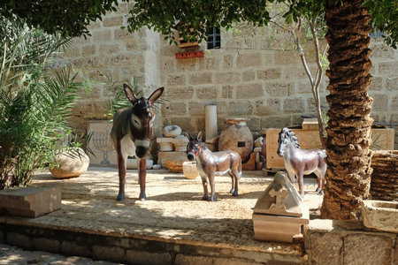 DEIR HAJLA, ISRAEL - JANUARY 11, 2020: Sculptures of donkeys in the courtyard of the Monastery of Gerasim of Jordanのeditorial素材