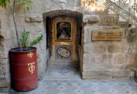 DEIR HAJLA, ISRAEL - JANUARY 11, 2020: Entrance to the crypt dedicated to the Holy Family  in the Monastery of Gerasim of Jordan. Inscription: Blessed are the pure in heartのeditorial素材