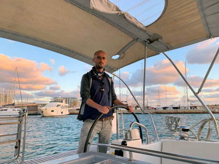 Skipper takes the yacht out of the marina