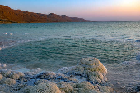 Salt crystals on the Dead Sea coast during sunsetの写真素材
