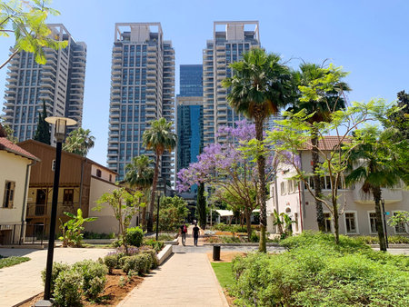 TEL-AVIV, ISRAEL - MAY 25, 2021: Historic buildings and modern skyscrapers in the restored Sarona quarterのeditorial素材