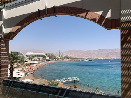 EILAT, ISRAEL - APRIL 15, 2021: View of the city beach in Eilat from the second floor of the shopping centerのeditorial素材