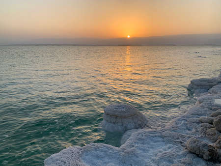 Sunrise and Salt crystals on the shore of the Dead Seaの写真素材
