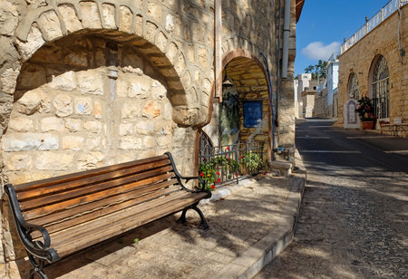 SAFED, ISRAEL - SEPTEMBER 24, 2017: Bench and Historical buildings in the old town of Safedのeditorial素材
