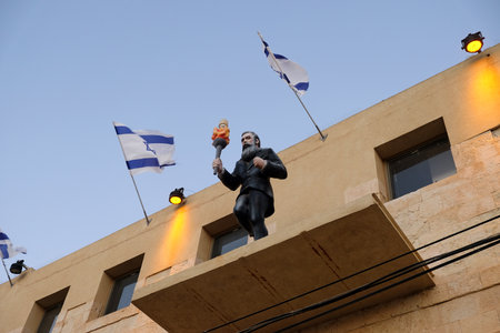 BEER SHEVA, ISRAEL - JULY 24, 2019: Sculpture of Herzl with a torch on the facade of the building of the Gateway to the Negevのeditorial素材