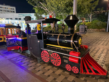 EILAT, ISRAEL - OCTOBER 26, 2023: Pleasure children's train rides children on the promenade in Eilat