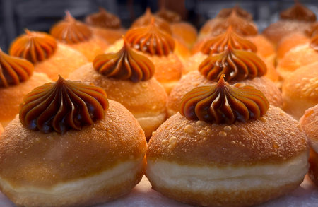 Sweet Hanukkah donuts on the counter of a candy storeの写真素材