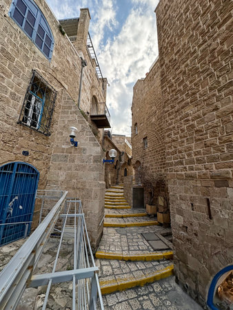 JAFFA, ISRAEL - DECEMBER 28, 2023: Narrow street in the historical part of the city of Jaffaの写真素材