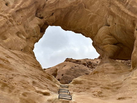 An arch formed by erosion and weathering in Timna Park in southern Israel in the Arava desert