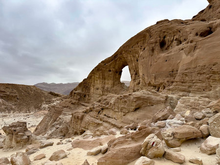 An arch formed by erosion and weathering in Timna Park in southern Israel in the Arava desert