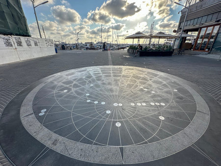 JAFFA, ISRAEL - JULY 03, 2025: A stylized map on the sidewalk in the Jaffa fishing port. The map...