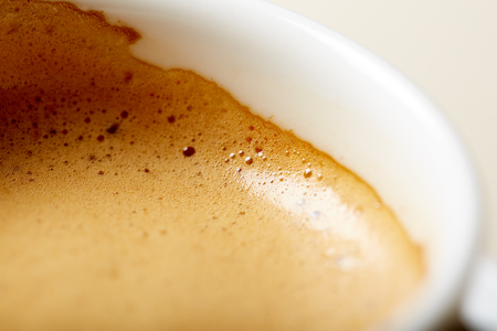 white cup of coffee on tableの写真素材