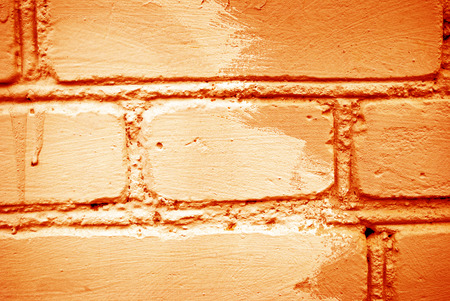 Rough texture of orange brick wallの写真素材