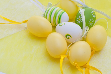 Colorful Easter eggs on a yellow backgroundの写真素材
