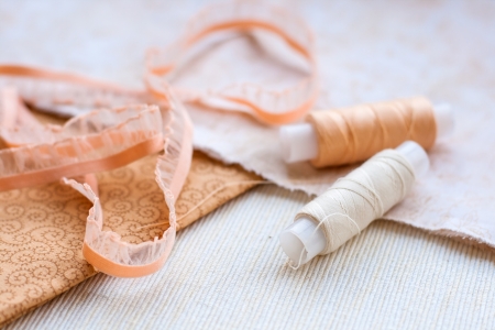 Spools of thread, lace and fabricの写真素材