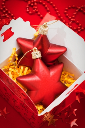 Red christmas decoration on red backgroundの写真素材