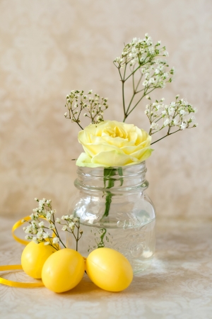Easter eggs and yellow rosesの写真素材