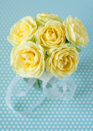 Easter eggs and yellow rosesの写真素材