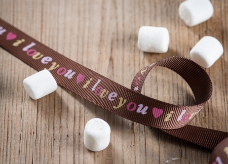 Sweet marshmallows and brown ribbonの写真素材