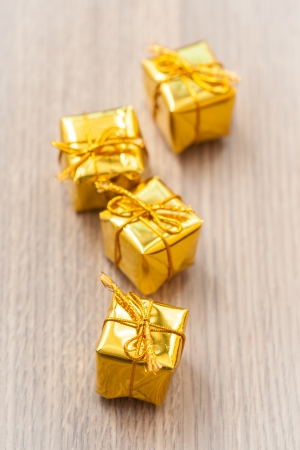 Yellow decorative gifts on wooden backgroundの写真素材