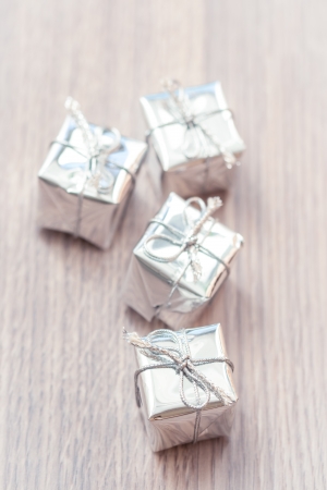 Silver decorative gifts on wooden backgroundの写真素材