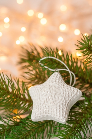 White star shaped Christmas decoration on the treeの写真素材