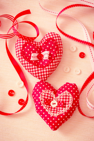Valentine handmade hearts with ribbons and buttons. Retro color toning.の写真素材