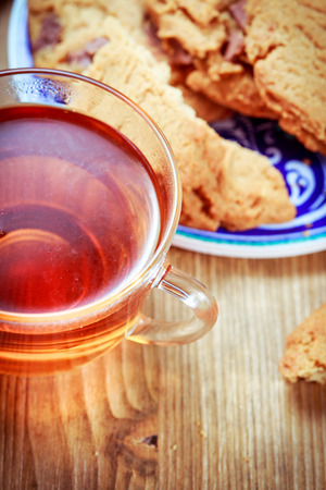 Cup of tea and cookies with chocolate piecesの写真素材