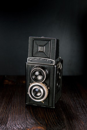 Old medium format camera on a wooden backgroundの写真素材