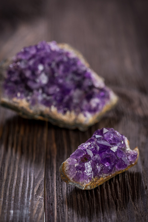 Beautiful Druse amethyst on dark wooden backgroundの写真素材