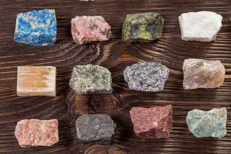 Collection set of minerals and stones on the old wooden table.の写真素材