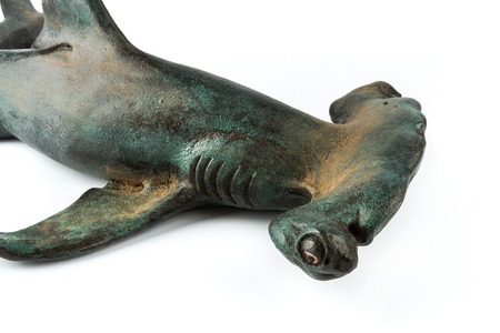 Decorative statuette hammerhead shark, isolated on white background.の写真素材