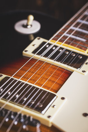 Electric guitar on wooden table close upの写真素材