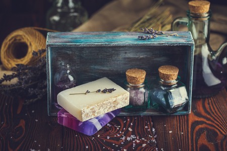 Lavender sea salt, natural organic soaps, lavender oil for massage spa in a wooden boxの写真素材