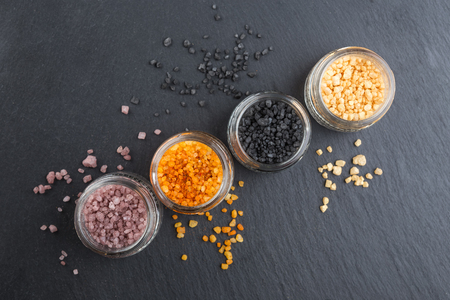 Set of different types of salts in glass jarsの写真素材