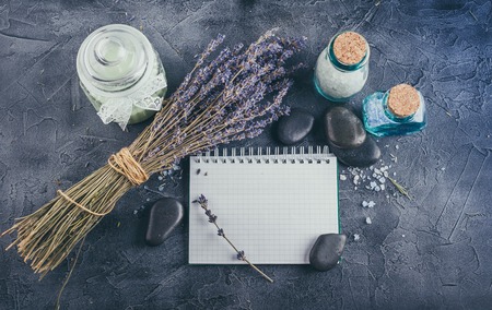 Little notebook, lavender, mineral sea salt and zen stones on a gray stone background. Top view.の写真素材