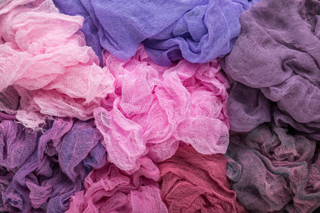 Multicolored background of violet, purple, pink and crimson colors of gauze fabricの写真素材