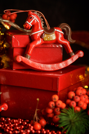 Christmas decorations with lights, toys and red gifts boxes on dark background, New Year and Christmas decorationの写真素材