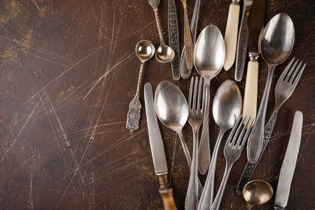 Metal kitchen utensils - forks, spoons of knivesの写真素材