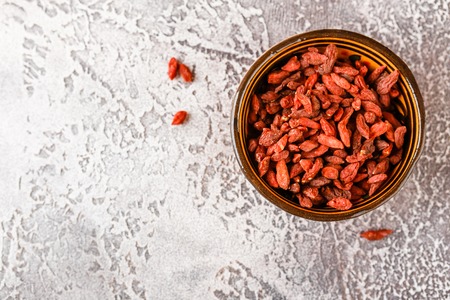 Superfood - goji berries in ceramic bowls. Top vewの写真素材