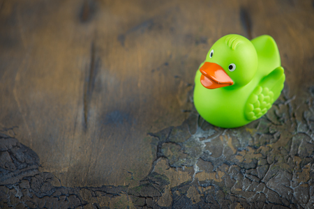 Set of colorful rubber ducks on a concrete backgroundの写真素材