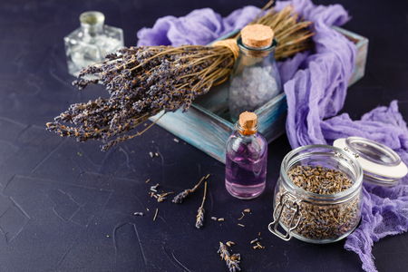 Lavender set - a bouquet of dry lavender, essential oil, cosmetic salt. Spa theme, relaxation and beautyの写真素材