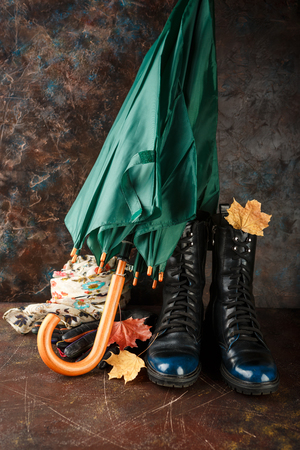 Fashion trend autumn winter. Autumn women's shoes, scarf, umbrella and glovesの写真素材