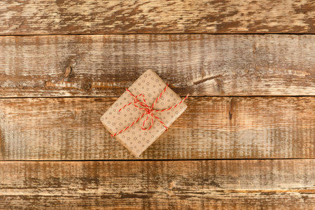 Craft paper gift box with as a present for Christmas, new year on blue background, top viewの写真素材