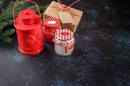 Christmas gift box, red lantern with candle, red balls and decoration lightの写真素材